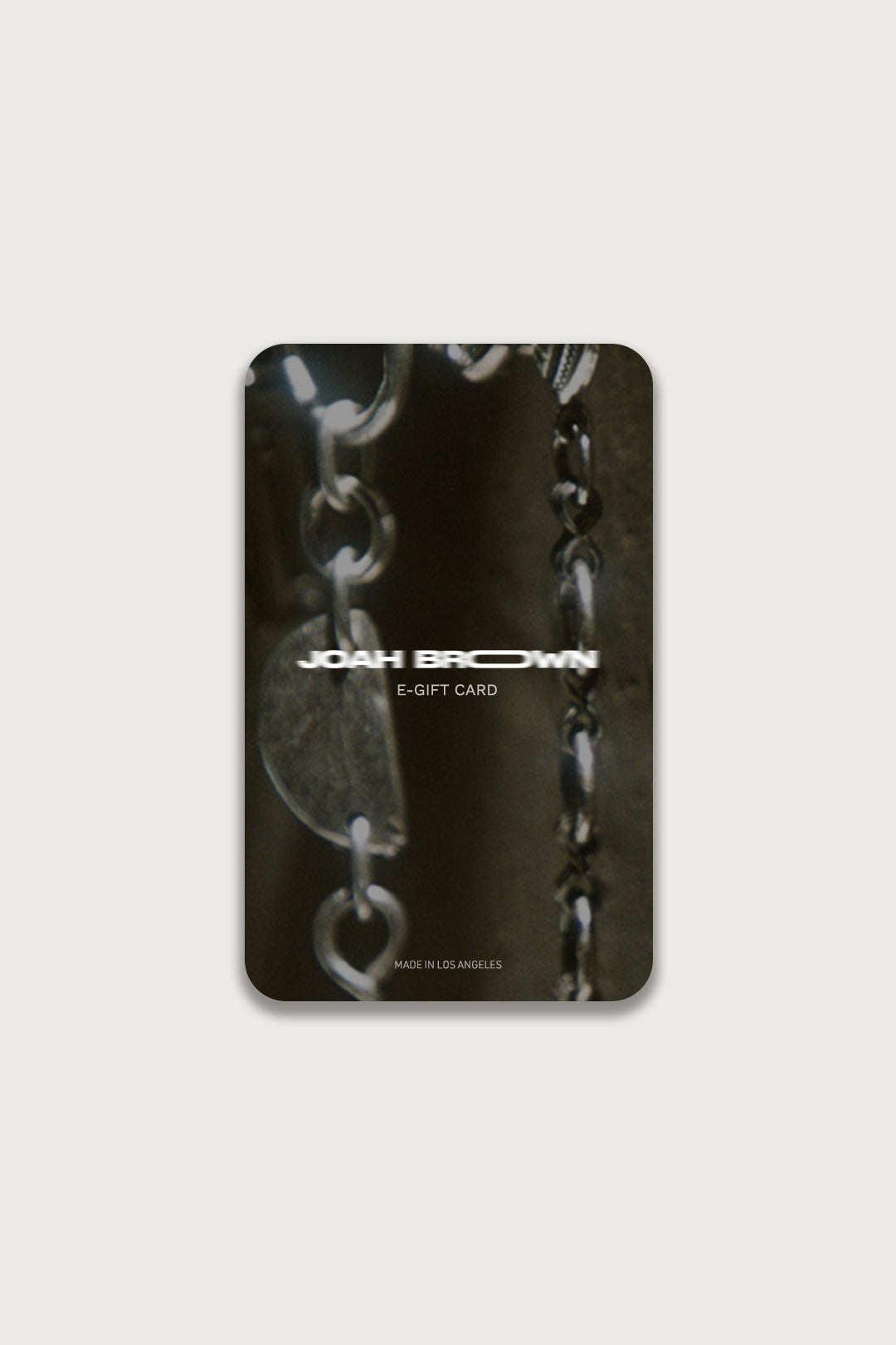 Front view of the Joah Brown gift card featuring a picture of silver chains in the background  and the Joah Brown logo in the foreground 