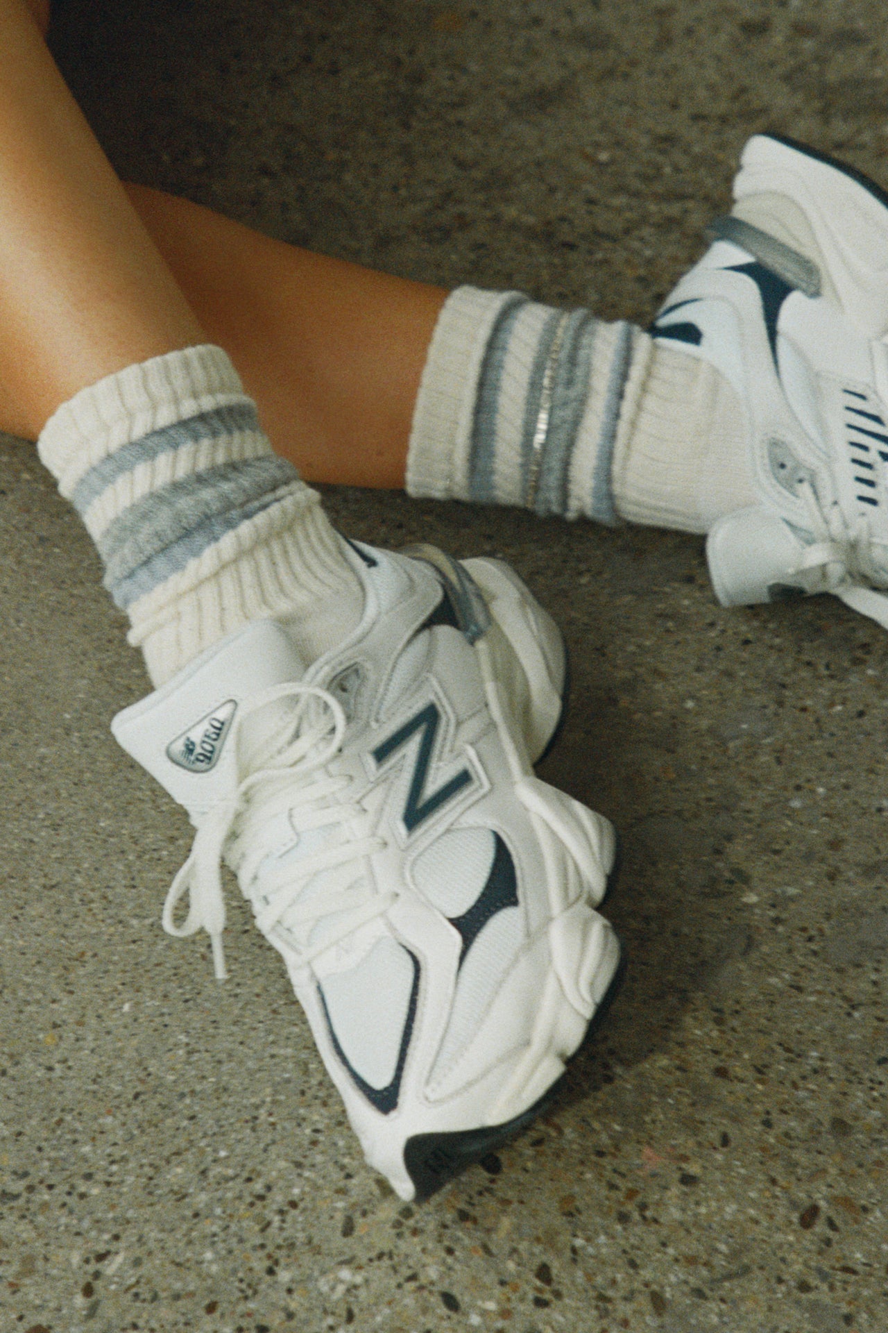 Close up front view of model wearing the crew style ribbed soft grey ash Classic Stripe Sock