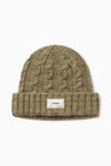 Front flat lay view of the soft and warm oak Cable Knit Beanie that has a custom JOAH BROWN 