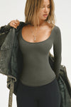 Front view of model posing in the fitted and stretchy mineral rib Classic Scoop Long Sleeve with a scoop neckline