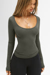 Front view of model posing in the fitted and stretchy mineral rib Classic Scoop Long Sleeve with a scoop neckline