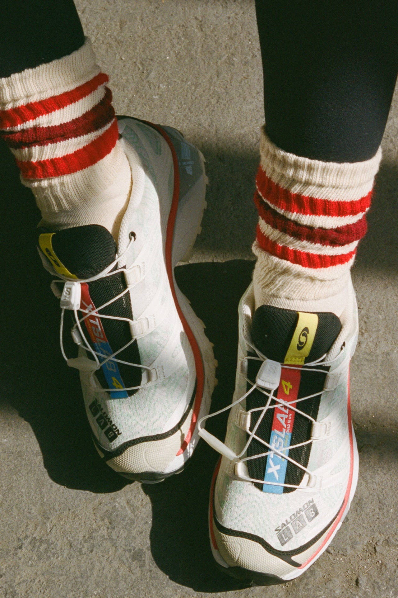 Front view of model wearing the crew style ribbed soft red burgundy Classic Stripe Sock