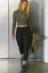 Full body front view of model posing in the fitted cropped mineral rib Cropped Crew Long Sleeve top with a crew neckline