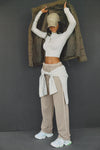 Fuol body front view of model posing in the fitted soft chalk modal Cropped Mock Neck Long Sleeve top with a raw cut hem