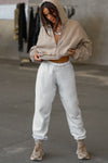 Full body front view of model posing in the oversized loose fit pearl grey french terry Oversized Jogger with an elastic waistband and ankle cuffs