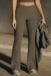 Front view of model from the waist down posing in the mid-rise fitted army luxe knit Fitted Mini Flare Pant with a slightly flared leg