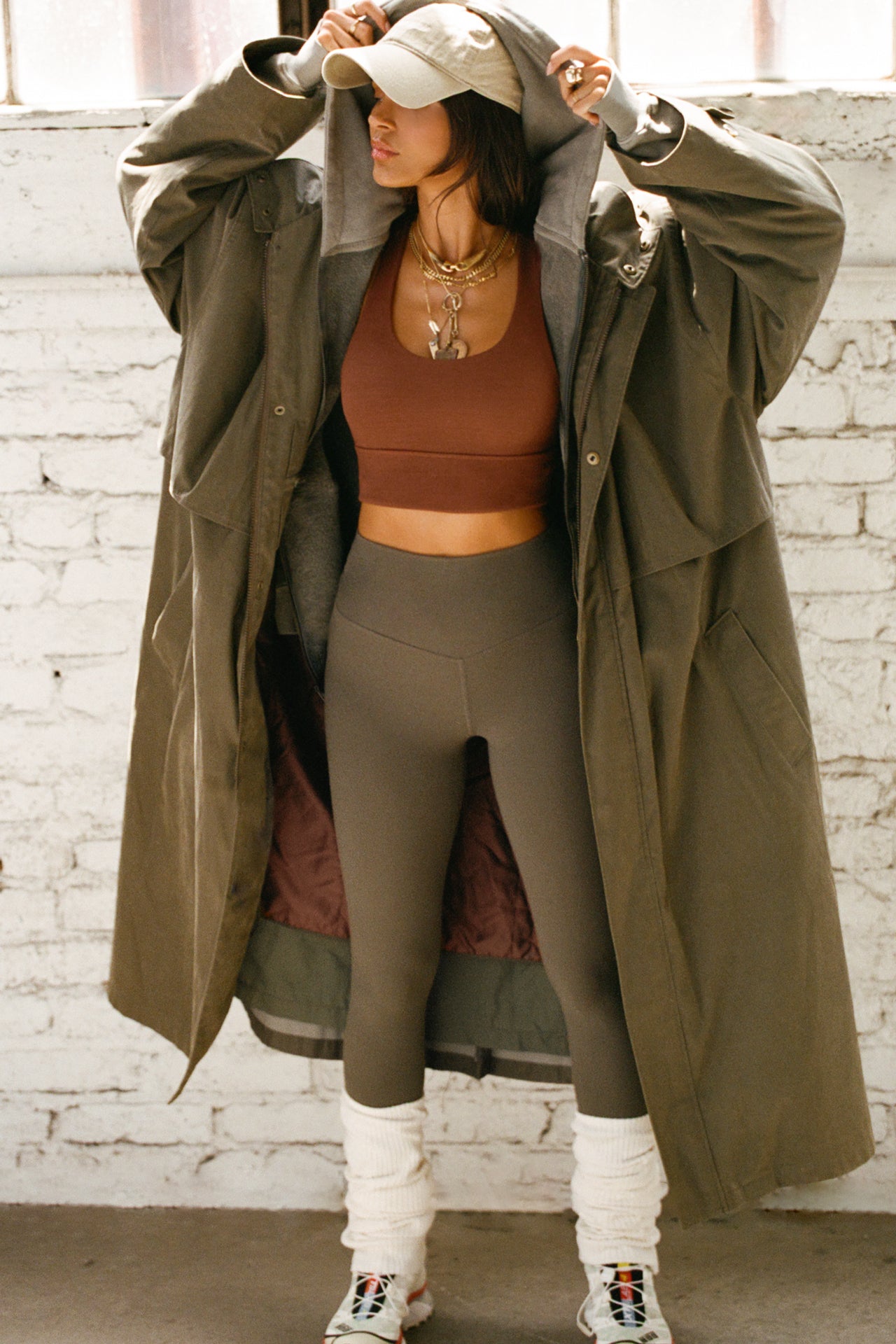 Full body front view of model posing in the fitted stretchy cropped oxblood flexrib Varsity Tank Bra with a scoop neckline