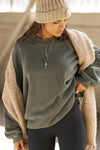 Front view of model posing in the relaxed fit washed sage french terry Oversized Crew Pullover sweatshirt with dropped sleeves and a ribbed crew neckline