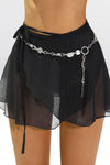 Close up front view of the mini black mesh skirt with an adjustable waist tie