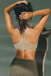 Back view of model posing in the the light green mesh scoop neck racerback bra