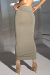 Back view of model from the waist down posing in the fitted sage modal Foldover Maxi Skirt with an adjustable fold-over waistband