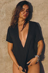 Front view of model posing in the full length relaxed fit black modal Plunge V Neck Tee with an plunging v-neckline