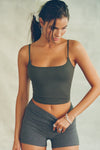 Front view of model posing in the soft and stretchy sueded essex Smoothing Cami with a scoop neckline and thin straps