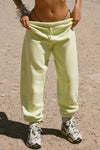 Front view of model from the waist down wearing the oversized loose fit melon french terry Oversized Jogger with an elastic waistband and ankle cuffs