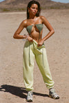 Full body front view of model posing in the oversized loose fit melon french terry Oversized Jogger with an elastic waistband and ankle cuffs