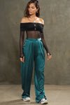 Full body front view of model posing in the soft and smooth classic pleated lagoon silk Relaxed Silk Trouser with a flattering wide leg, zip fly and side pockets.