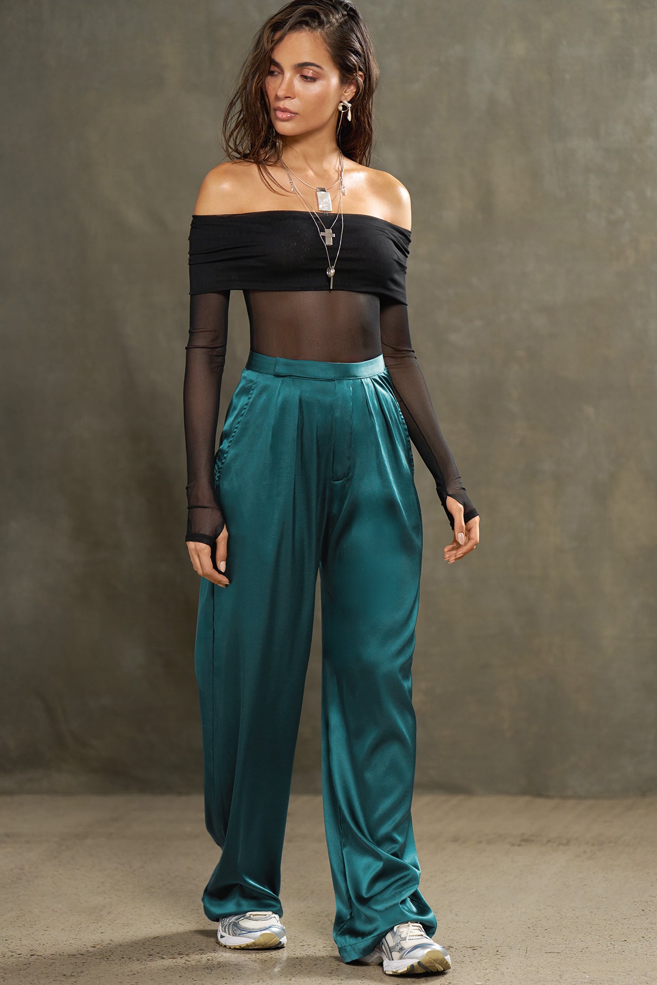 Full body front view of model posing in the soft and smooth classic pleated lagoon silk Relaxed Silk Trouser with a flattering wide leg, zip fly and side pockets.