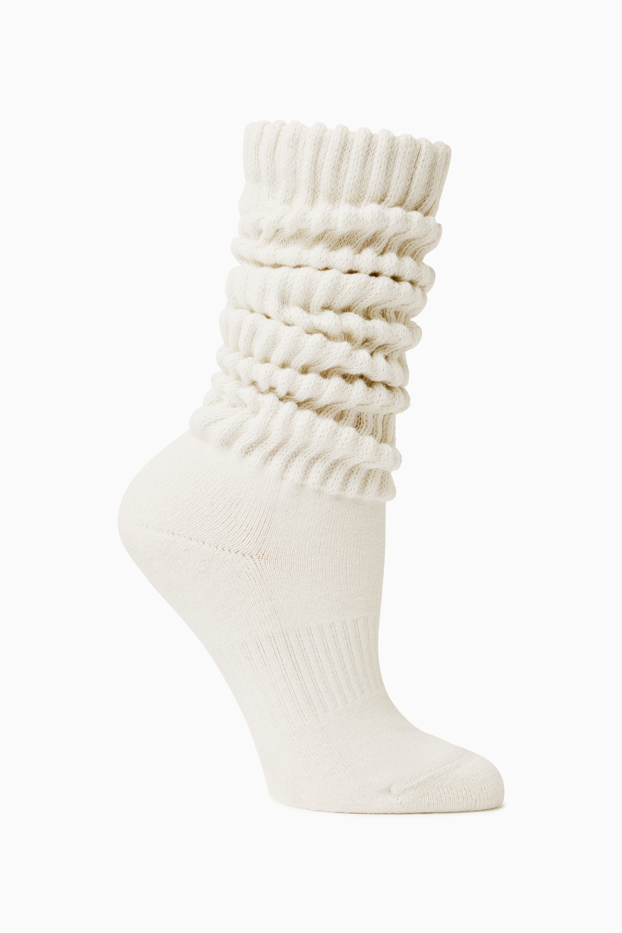 Flat lay side view of the slouchy off white Scrunch Sock with extra long ribbed cuffs