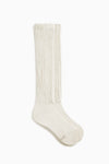 Flat lay side view of the slouchy off white Scrunch Sock with extra long ribbed cuffs