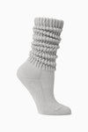 Flat lay side view of the slouchy salt Scrunch Sock with extra long ribbed cuffs