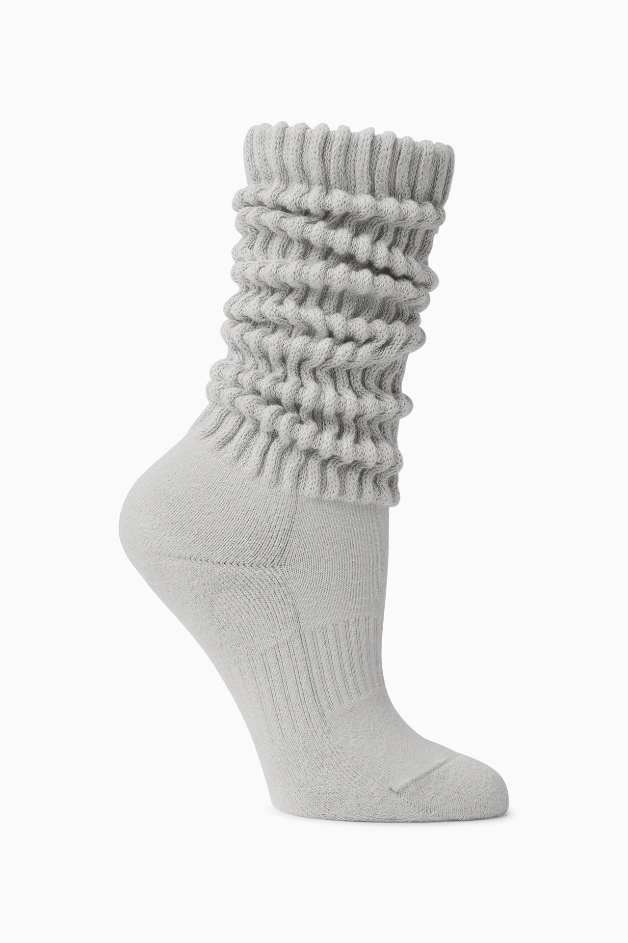 Flat lay side view of the slouchy salt Scrunch Sock with extra long ribbed cuffs