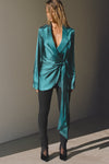 Bull body front view of model posing in the smooth and soft lagoon Silk Wrap Blazer top with an adjustable tie waist and shawl collar neckline.