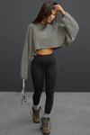 Full body front view of model posing in the cropped relaxed fit haze cotton Slouchy Crop Lonng Sleeve top with a crew neckline, dropped shoulders and oversized sleeves